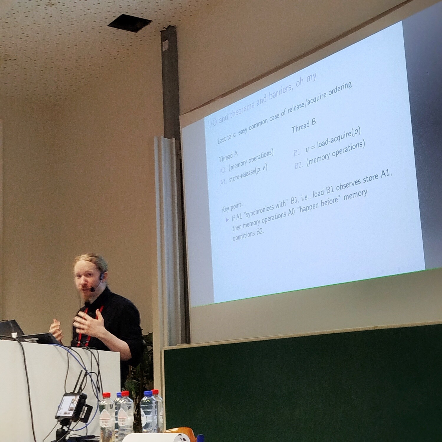 Riastradh presenting with a slide showing release/acquire ordering