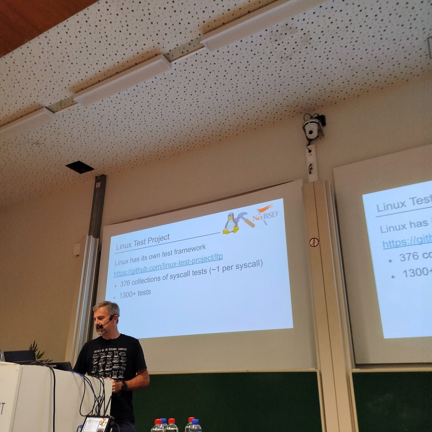 Stephen presenting with a slide about Linux Test Project in the background